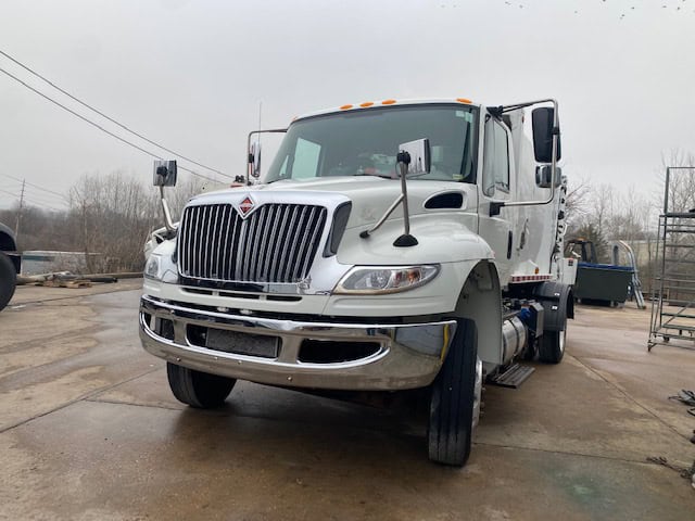 Front view of a garbage truck.